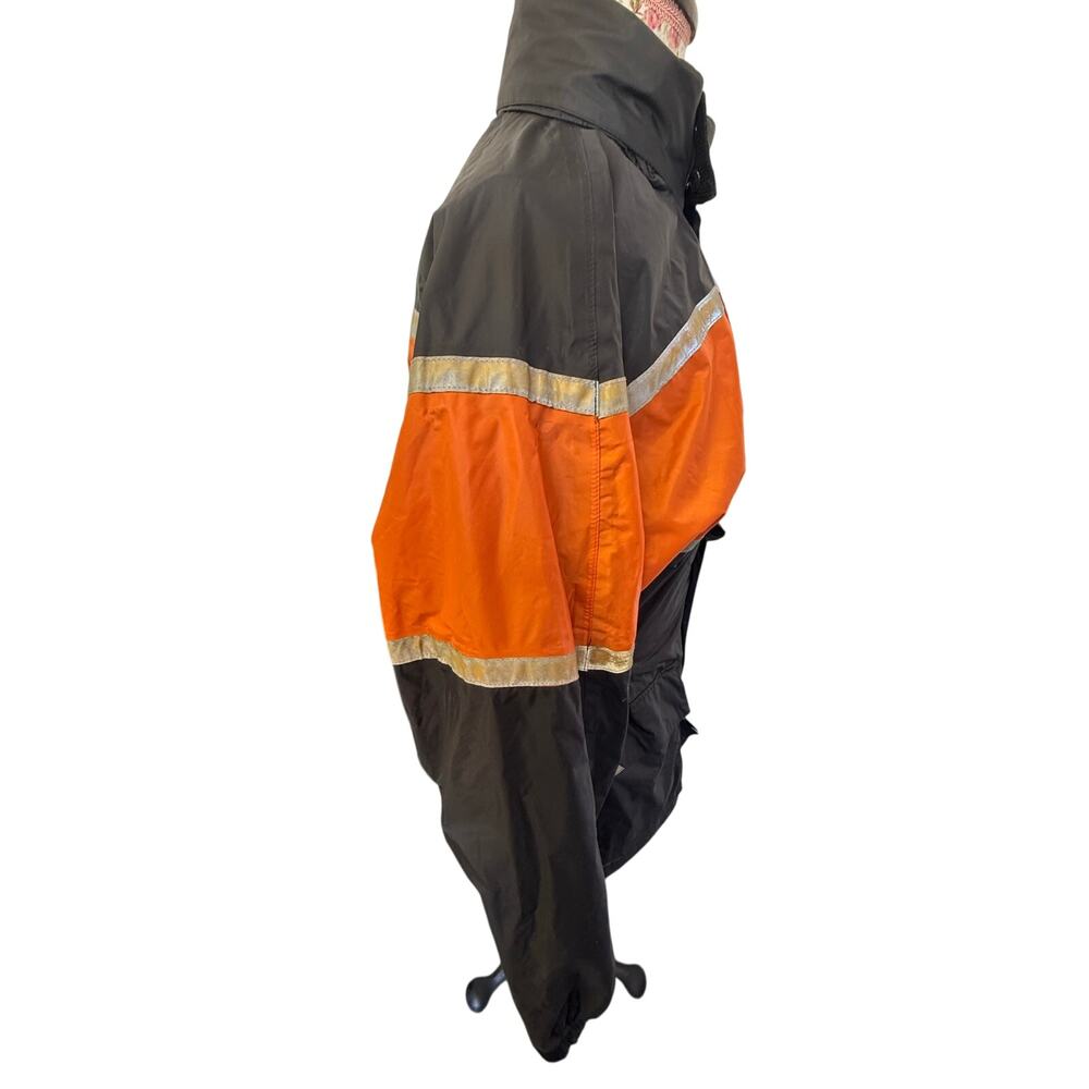 Nelson Rigg black an orange vented rain jacket The jacket is made of waterproof